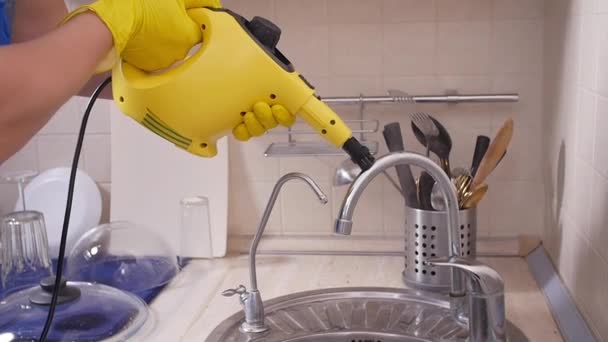 House cleaning concept. Man cleaning kitchen with steam cleaner — 비디오