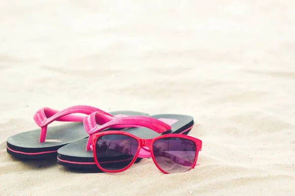 Vacations, Summer,red glasses with sandal on the beach.