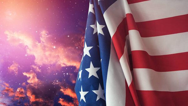 American flag with night sky background.