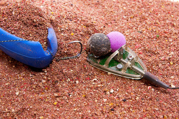 Dry feed for carp fishing as background. Ready for use Carp bait