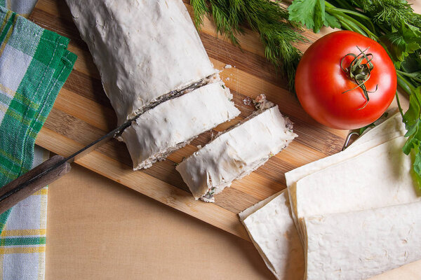 Pieces of cutted pita bread or lavash roll with cottage cheese o