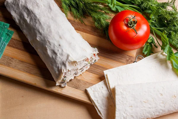 Pita bread or lavash wrapped with cottage cheese or curd, chicke