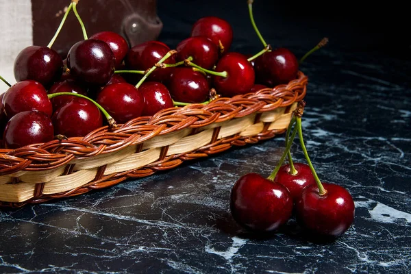 Several red sweet cherries on the table. Fresh organic cherry in