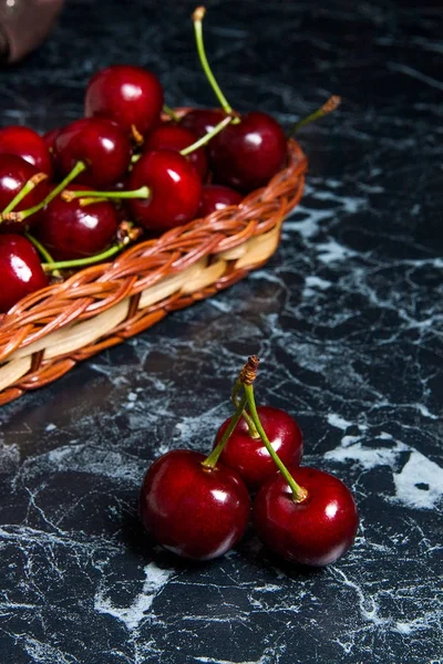 Several red sweet cherries on the table. Fresh organic cherry in