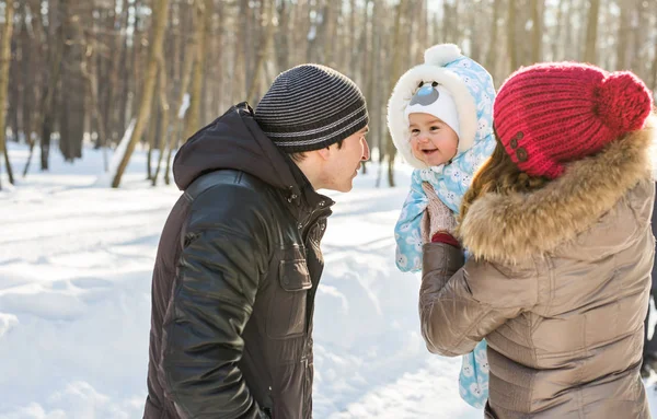 Happy family - Mother, father and child boy on a winter walk. — Stock Photo, Image