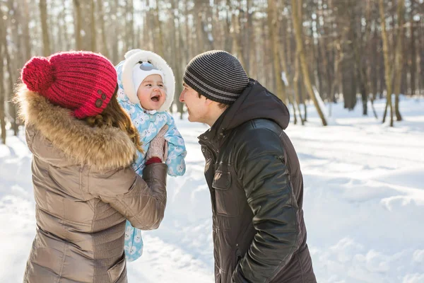 Happy family - Mother, father and child boy on a winter walk. — Stock Photo, Image