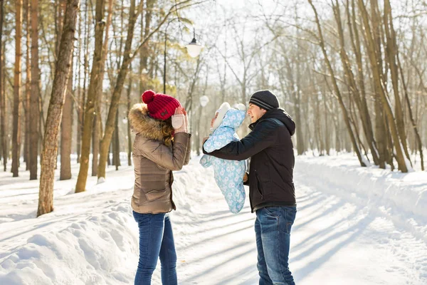 Happy family - Mother, father and child boy on a winter walk. — Stock Photo, Image