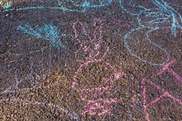 childrens drawings of crayons on the pavement
