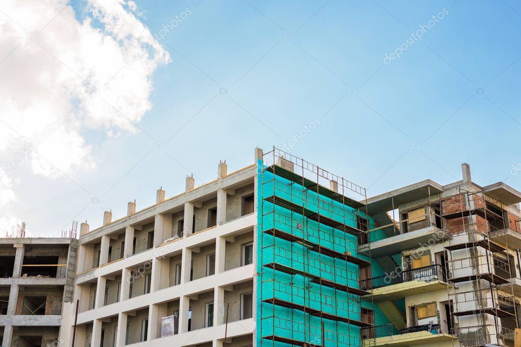 building under construction against blue sky