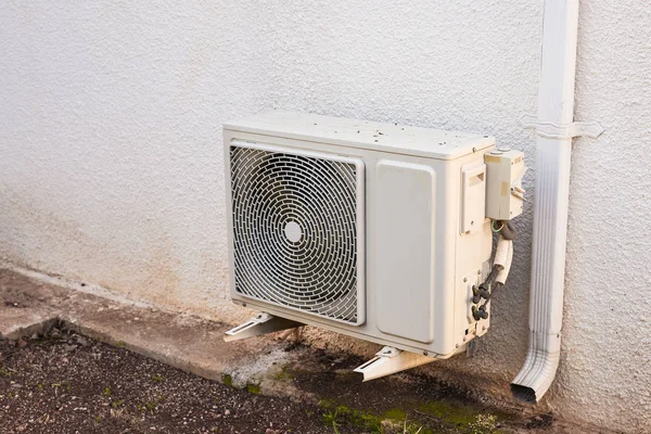 Air conditioner compressor installed on a building — Stock Photo, Image