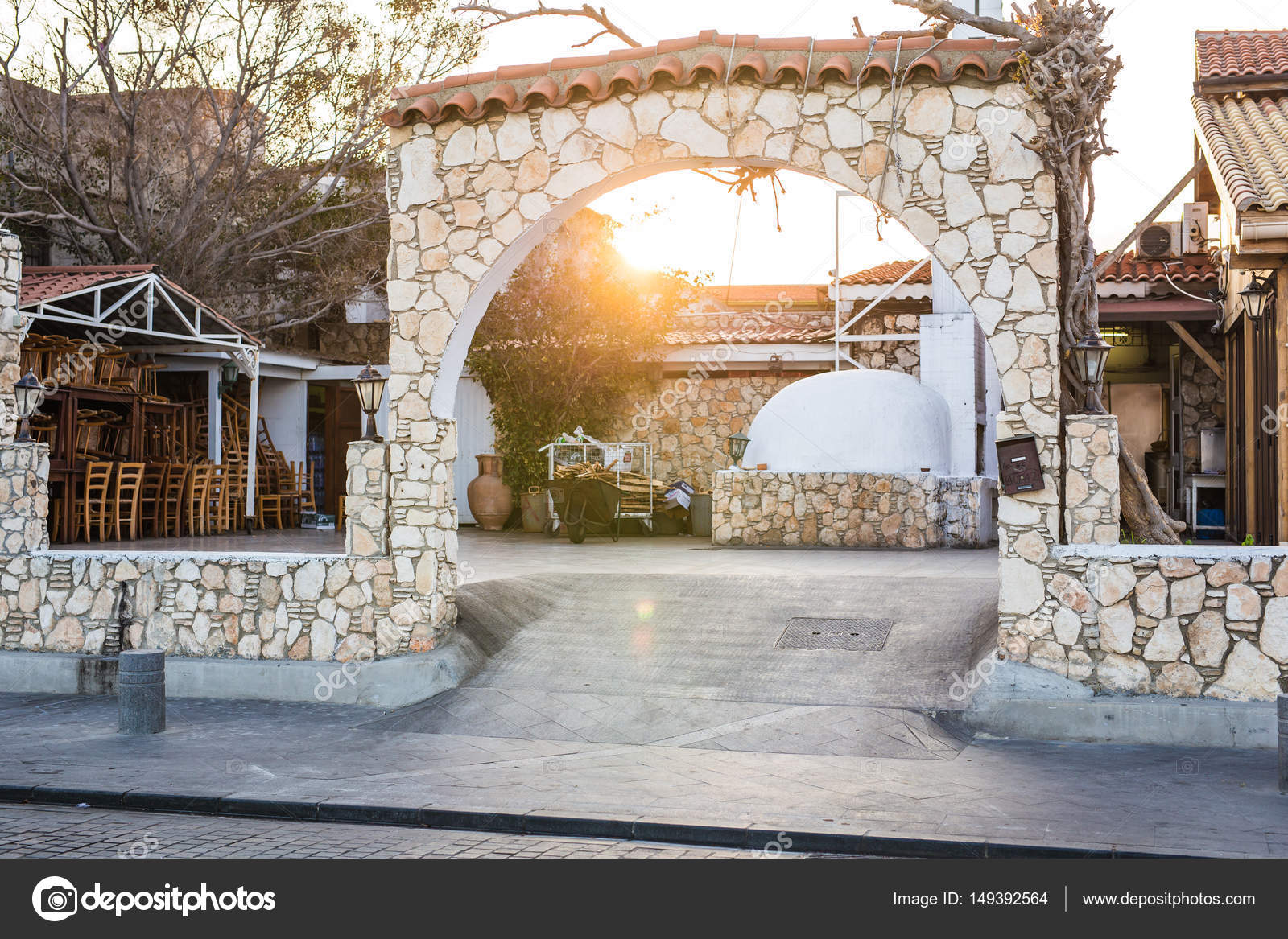 empty closed outdoor cafe furniture pile of chairs stock photo