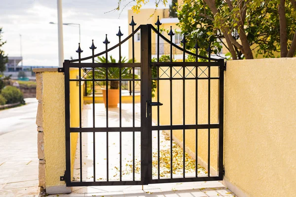 Wrought iron gate. Closed entrance to private territory — Stock Photo, Image