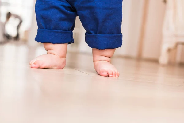 Baby legs. First steps. Stock Photo