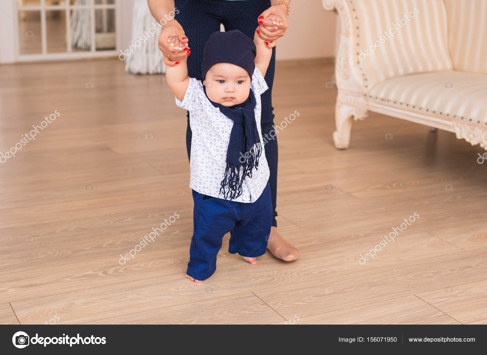 Baby Taking First Steps With Mother Help Stock Photo C Satura