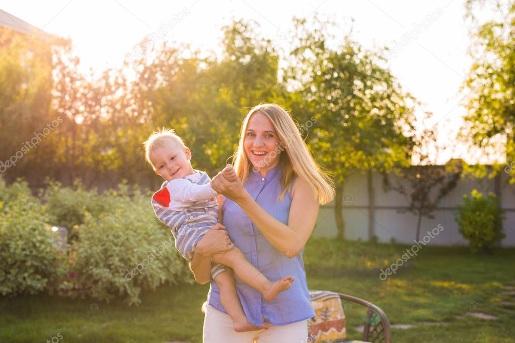 baby boy with his mum outdoors