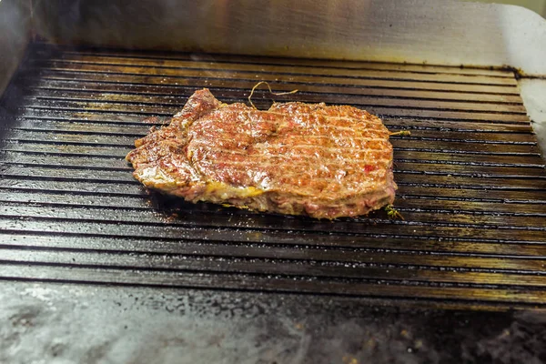 Closeup of a steak on grill — Stock Photo, Image
