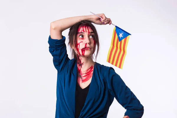 Portrait young catalan victim woman holding flag of catalonia isolated on white background. Protest against terrorism.