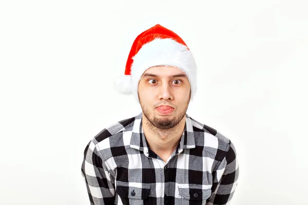 X-mas, vacaciones de invierno y el concepto de la gente - hombre divertido en sombrero de Santa Claus sobre fondo blanco —  Fotos de Stock