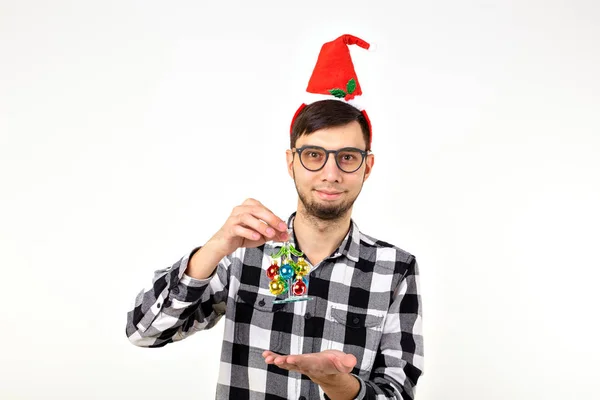 Holidays and presents concept - Funny emotional man in Christmas hat on white background with copyspace — Stock Photo, Image