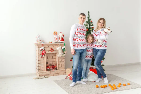 Holidays concept - happy family mother father and child at christmas tree at home — Stock Photo, Image