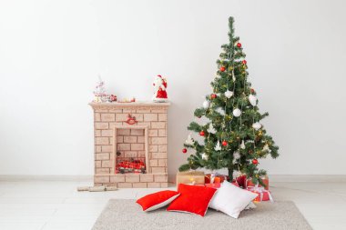 Fireplace and Christmas tree with presents in living room clipart