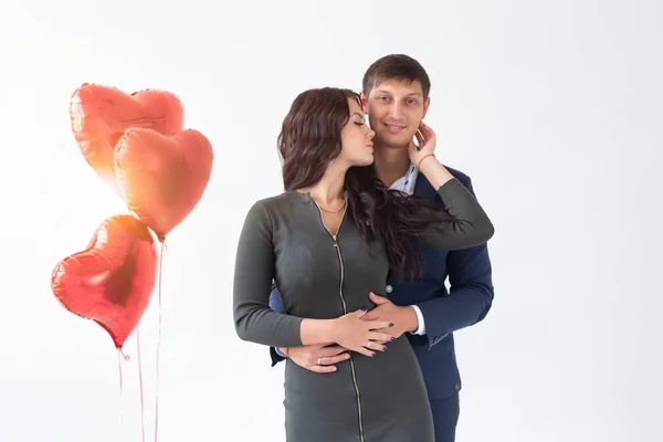 Holidays and relationship concept - Young couple on Valentines Day on white background — Stock Photo, Image