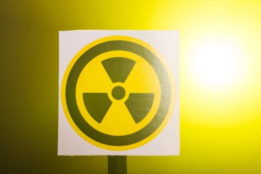 Radioactivity and sign concept - Radiation hazard sign on background
