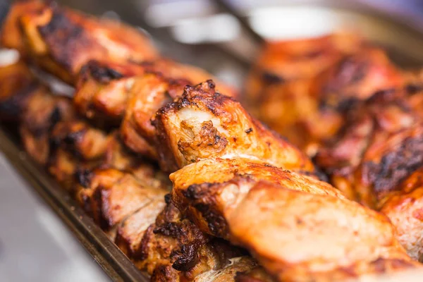 Delicious bbq kebab grilling on open grill, outdoor kitchen. Food festival in city. Tasty food roasting on skewers, food-court. Summer picnic — Stock Photo, Image