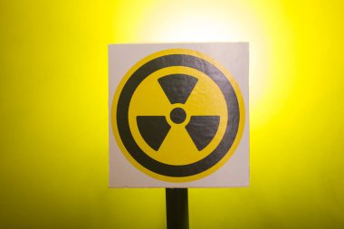 Radiation and danger concept - Radioactivity sign and the dramatic smokey background