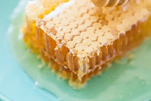 Honey with wooden honey dipper and honeycombs — 스톡 사진