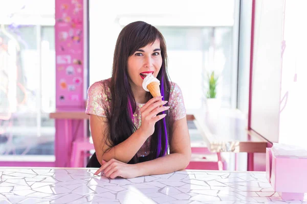 Summer, youth and dessert concept - Pretty girl enjoying an ice-cream cone in cafe — 스톡 사진
