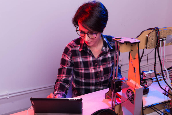 A student woman print prototype on 3D printer