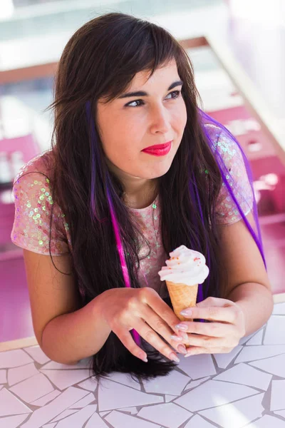 Summer, youth and dessert concept - Pretty girl enjoying an ice-cream cone in cafe — 스톡 사진