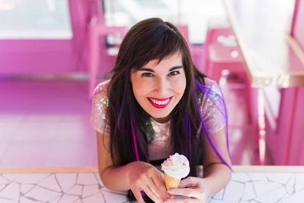 Summer, youth and dessert concept - Pretty girl enjoying an ice-cream cone in cafe — 스톡 사진