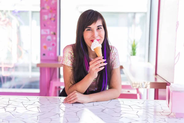 Summer, youth and dessert concept - Pretty girl enjoying an ice-cream cone in cafe — 스톡 사진