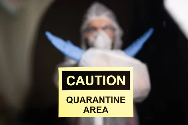 Man in protective white overalls, mask and glasses on his face.Coronavirus, pandemic, flu and quarantine concept. — Stock Photo, Image