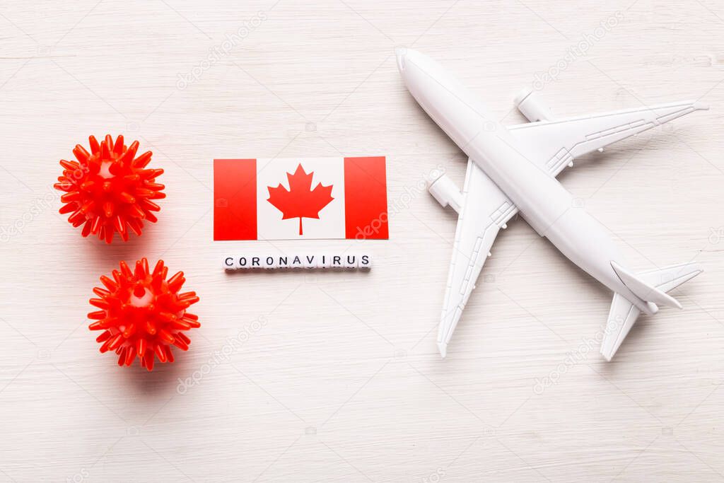 Flight ban and closed borders for tourists and travelers with coronavirus covid-19. Airplane and flag of Canada on a white background. Coronavirus pandemic.