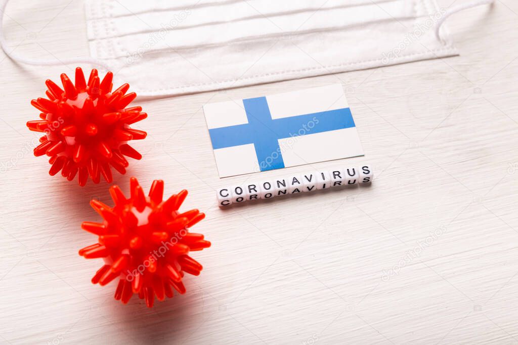 Coronavirus covid-19 concept. Top view protective breathing mask and flag of Finland. Novel Chinese Coronavirus outbreak.