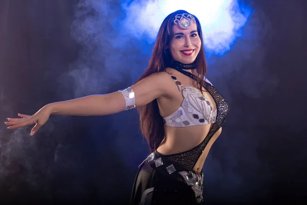 Spirituality dance. Beautiful sexy woman with luxury glossy eastern make-up dancing tribal fusion. Belly dance. — Stock Photo, Image