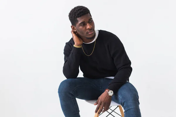 Youth street fashion concept - Portrait of confident sexy black man in stylish sweatshirt on white background. — Stock Photo, Image