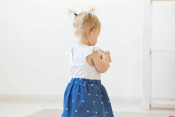 Cute baby girl playing indoors. Childhood, infant and children concept. Close-up. — Stock Photo, Image