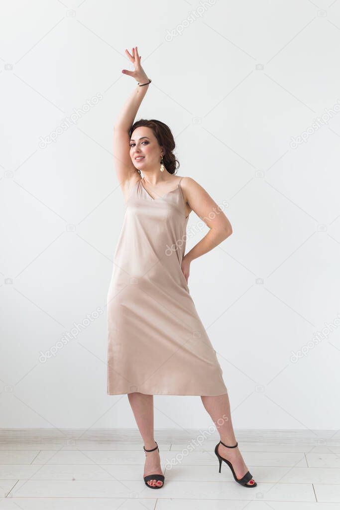Latina dance, strip dance, contemporary and bachata lady concept - Woman dancing improvisation on a white background