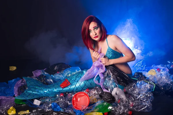 Fantasy mermaid in deep ocean sad because water pollution. Plastic trash and bottles pollution in ocean. Ecocatastrophe, garbage and plastic recycling concept. — Stock Photo, Image
