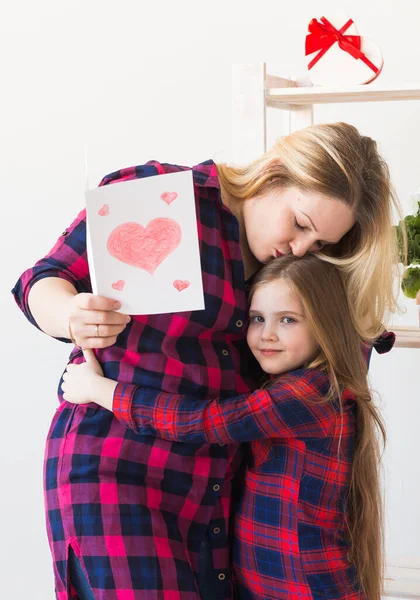 Mothers Day, holidays and family holidays - Mother holds greeting card from her lovely daughter.