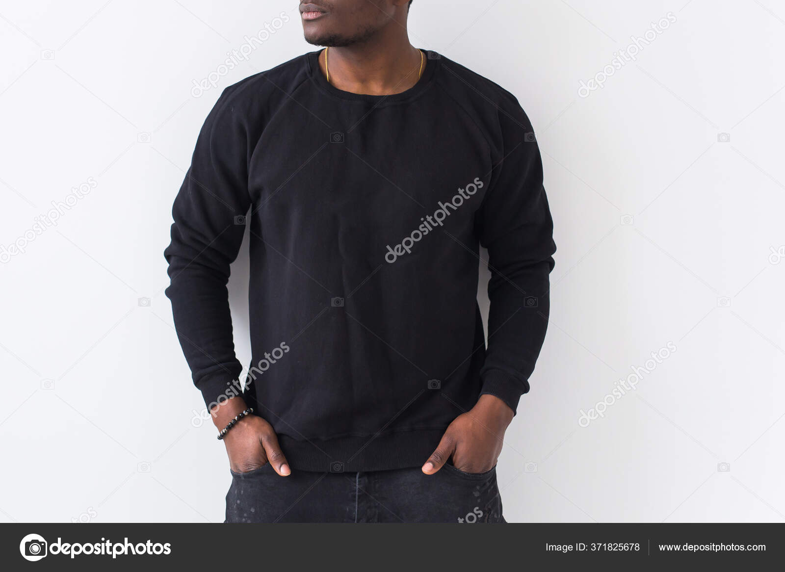 Cool Stylish Young Man With Hairstyle And Stubble In A Trendy Blue  Sweatshirt With Fashion Glasses Stands Near A White Wall With Sunlight  Stock Photo - Download Image Now - iStock