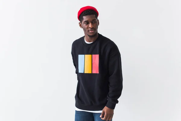 Young handsome african american man with an afro hairstyle. Portrait on white background with copyspace. Guy looking aside. — Stock Photo, Image