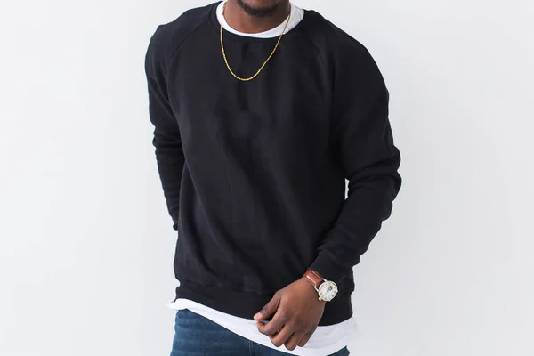 Close-up of African American man posing in black sweatshirt on a white background. Youth street fashion photo with afro hairstyle. — Stock Photo, Image