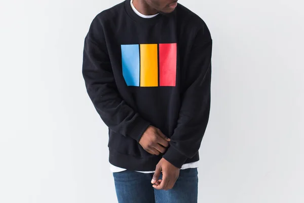 Close-up of handsome african american man posing in black sweatshirt on white background. — Stock Photo, Image