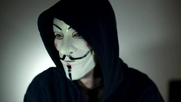 Scene of a masked Anonymous computer hacker — Stock Video