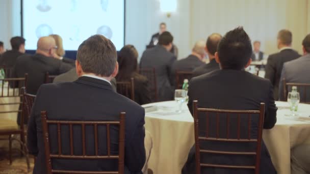 Businessmen listen at a conference — Stock Video